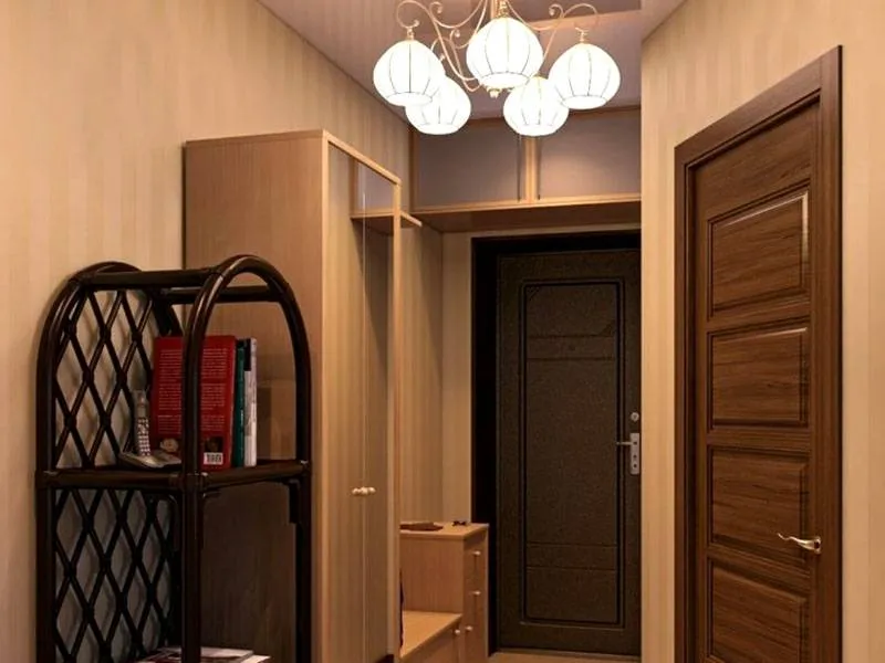 Функциональное оформление в маленьком коридоре выполняется с помощью вместительной и компактной мебели